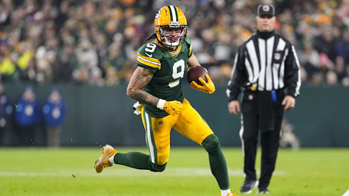 Dec 23, 2024; Green Bay, Wisconsin, USA;  Green Bay Packers wide receiver Christian Watson (9) rushes with the football during the second quarter against the New Orleans Saints at Lambeau Field.