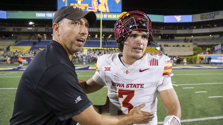 Iowa State Cyclones head coach Matt Campbell celebrates with quarterback Rocco Becht after defeating the West Virginia Mountaineers at Mountaineer Field at Milan Puskar Stadium. Iowa State Cyclones head coach Matt Campbell celebrates with quarterback Rocco Becht after defeating the West Virginia Mountaineers at Mountaineer Field at Milan Puskar Stadium.