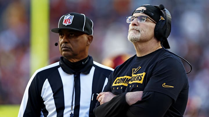 Nov 24, 2024; Landover, Maryland, USA; Washington Commanders head coach Dan Quinn watches a replay on the video board during the third quarter of the game against the Dallas Cowboys at Northwest Stadium. Mandatory Credit: Peter Casey-Imagn Images