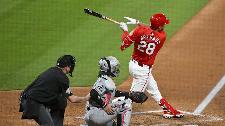 May 23, 2025; St. Louis, Missouri, USA; St. Louis Cardinals third baseman Nolan Arenado (28) hits a three run triple against the Arizona Diamondbacks during the sixth inning at Busch Stadium. Mandatory Credit: Jeff Curry-Imagn Images May 23, 2025; St. Louis, Missouri, USA; St. Louis Cardinals third baseman Nolan Arenado (28) hits a three run triple against the Arizona Diamondbacks during the sixth inning at Busch Stadium. Mandatory Credit: Jeff Curry-Imagn Images