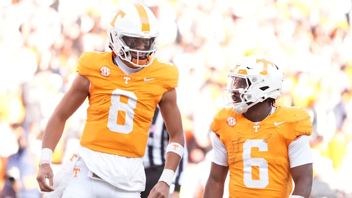 Tennessee quarterback Nico Iamaleava, left, talks with running back Dylan Sampson during a game against UTEP on Nov. 23, 2024, in Knoxville, Tenn. The Vols enjoy playoff positioning if they beat Vanderbilt in the regular-season finale.