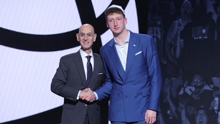 Jun 25, 2025; Brooklyn, NY, USA; Danny Wolf stands with NBA commissioner Adam Silver after being selected as the 27th pick by the Brooklyn Nets in the first round of the 2025 NBA Draft at Barclays Center. Mandatory Credit: Brad Penner-Imagn Images Jun 25, 2025; Brooklyn, NY, USA; Danny Wolf stands with NBA commissioner Adam Silver after being selected as the 27th pick by the Brooklyn Nets in the first round of the 2025 NBA Draft at Barclays Center. Mandatory Credit: Brad Penner-Imagn Images