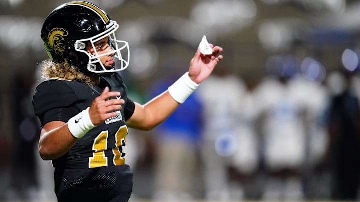 Oct 20, 2023; Carrollton, GA, USA; Carrollton Trojans quarterback Julian Lewis (10) reacts to a play against the Westlake Lions during the first half at Grisham Stadium. The 15-year-old Carrollton High student has already committed to playing for the University of Southern California Trojans and has been considered one of the top high school quarterback prospects. Mandatory Credit: John David Mercer-USA TODAY Sports
