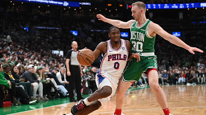 Dec 25, 2024; Boston, Massachusetts, USA; Philadelphia 76ers guard Tyrese Maxey (0) drives to the basket against Boston Celtics forward Sam Hauser (30)during the first half at TD Garden. Mandatory Credit: Eric Canha-Imagn Images