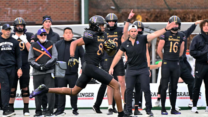 Nov 22, 2025; Chicago, Illinois, USA; Northwestern Wildcats wide receiver Hayden Eligon II (80) runs the ball against the Minnesota Golden Gophers during the second half at Wrigley Field. Mandatory Credit: Patrick Gorski-Imagn Images