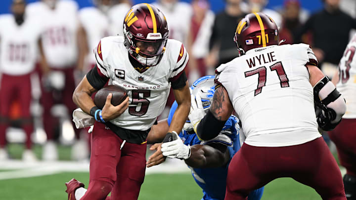 Jan 18, 2025; Detroit, Michigan, USA; Washington Commanders quarterback Jayden Daniels (5) scrambles out of the pocket during the fourth quarter against Detroit Lions in a 2025 NFC divisional round game at Ford Field. Mandatory Credit: Lon Horwedel-Imagn Images Jan 18, 2025; Detroit, Michigan, USA; Washington Commanders quarterback Jayden Daniels (5) scrambles out of the pocket during the fourth quarter against Detroit Lions in a 2025 NFC divisional round game at Ford Field. Mandatory Credit: Lon Horwedel-Imagn Images