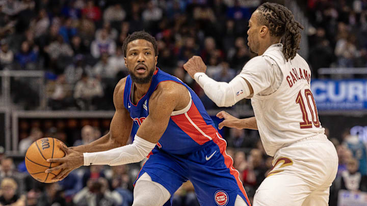 Feb 5, 2025; Detroit, Michigan, USA; Cleveland Cavaliers guard Darius Garland (10) defends against Detroit Pistons guard Malik Beasley (5) during the first half at Little Caesars Arena. Mandatory Credit: David Reginek-Imagn Images