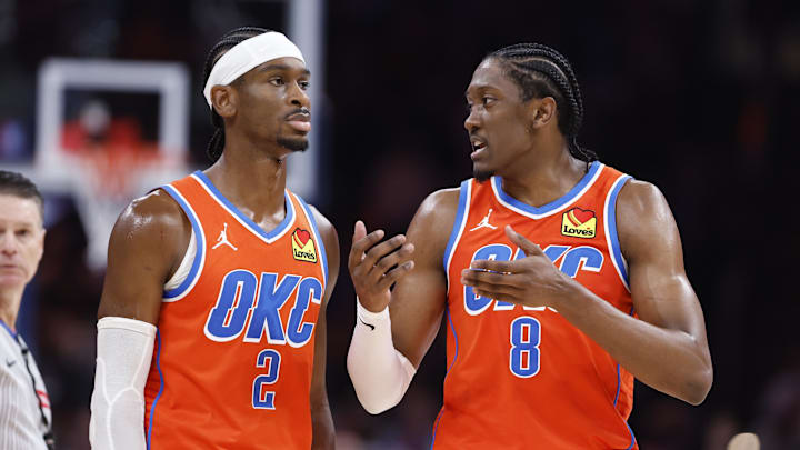 Nov 10, 2024; Oklahoma City, Oklahoma, USA; Oklahoma City Thunder guard Shai Gilgeous-Alexander (2) and forward Jalen Williams (8) talk during a time out against the Golden State Warriors during the second half at Paycom Center.