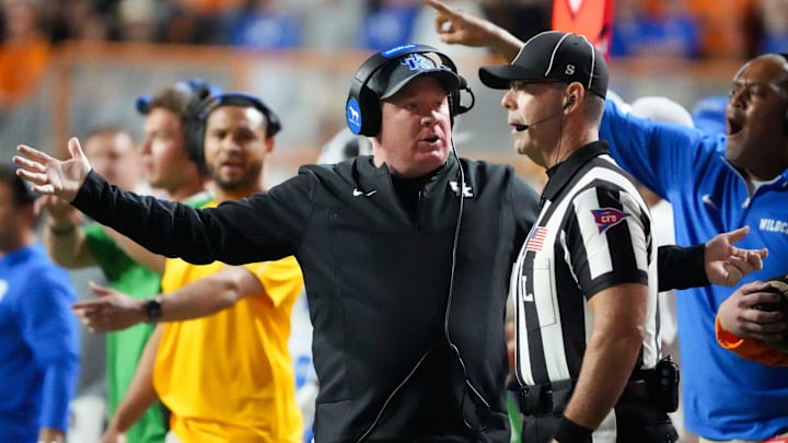 Kentucky football coach Mark Stoops talks with an official during an NCAA college football game between Tennessee and Kentucky on Saturday, Nov. 2, 2024, in Knoxville, Tenn.