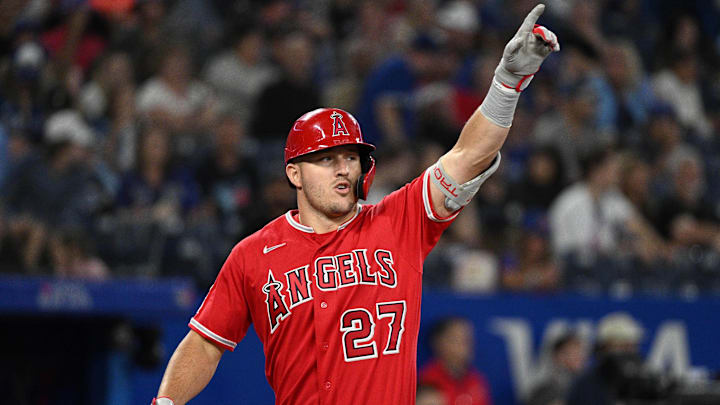 Aug 26, 2022; Toronto, Ontario, CAN; Los Angeles Angels center fielder Mike Trout (27) reacts after hitting a two run home run against the Toronto Blue Jays in the eighth inning at Rogers Centre. Mandatory Credit: Dan Hamilton-Imagn Images