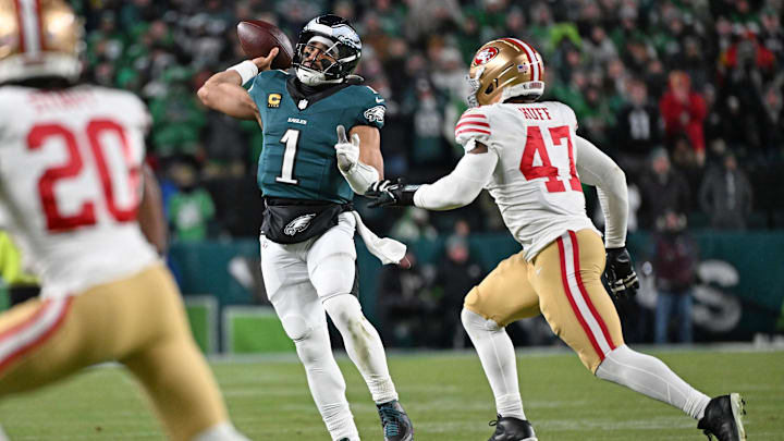 Jan 11, 2026; Philadelphia, PA, USA; Philadelphia Eagles quarterback Jalen Hurts (1) runs under pressure from San Francisco 49ers defensive end Bryce Huff (47) during the fourth quarter in an NFC Wild Card Round game at Lincoln Financial Field. Mandatory Credit: Eric Hartline-Imagn Images