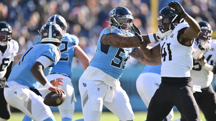 Nov 30, 2025; Nashville, Tennessee, USA; Tennessee Titans offensive tackle JC Latham (55) attempts to slow down Jacksonville Jaguars defensive end Josh Hines-Allen (41) during the first half at Nissan Stadium. Mandatory Credit: Steve Roberts-Imagn Images Nov 30, 2025; Nashville, Tennessee, USA; Tennessee Titans offensive tackle JC Latham (55) attempts to slow down Jacksonville Jaguars defensive end Josh Hines-Allen (41) during the first half at Nissan Stadium. Mandatory Credit: Steve Roberts-Imagn Images