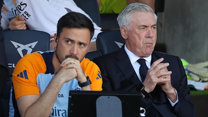 Davide Ancelotti (left) and Carlo Ancelotti look on from the sidelines from last weekend's El Clasico.