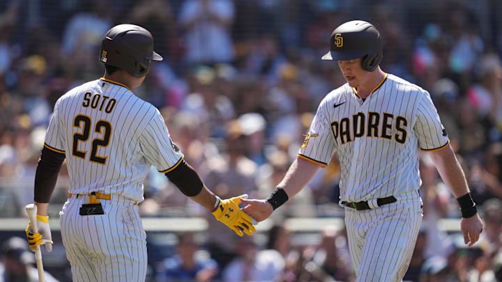 San Diego Padres first baseman Garrett Cooper (right) is congratulated by left fielder Juan Soto (22) after scoring on an RBI single by right fielder Fernando Tatis Jr. (not pictured) against the Miami Marlins during the seventh inning at Petco Park on Aug. 23, 2023. San Diego Padres first baseman Garrett Cooper (right) is congratulated by left fielder Juan Soto (22) after scoring on an RBI single by right fielder Fernando Tatis Jr. (not pictured) against the Miami Marlins during the seventh inning at Petco Park on Aug. 23, 2023.