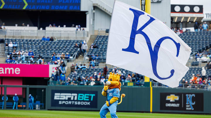 Apr 5, 2025; Kansas City, Missouri, USA; Kansas City Royals mascot Sluggerrr waves the flag prior to the game against the Baltimore Orioles at Kauffman Stadium. Mandatory Credit: William Purnell-Imagn Images Apr 5, 2025; Kansas City, Missouri, USA; Kansas City Royals mascot Sluggerrr waves the flag prior to the game against the Baltimore Orioles at Kauffman Stadium. Mandatory Credit: William Purnell-Imagn Images