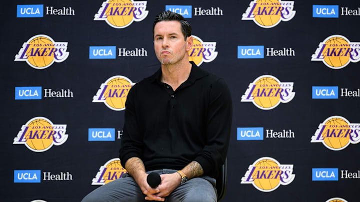 Sep 25, 2025; El Segundo, CA, USA; Los Angeles Lakers head coach JJ Redick, right, looks on during a press conference to preview the 2025-26 season at UCLA Health Training Center. Mandatory Credit: William Liang-Imagn Images