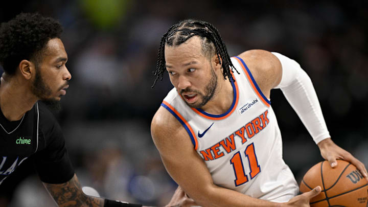 Nov 19, 2025; Dallas, Texas, USA; New York Knicks guard Jalen Brunson (11) looks to move the ball past Dallas Mavericks forward P.J. Washington (25) during the second half at the American Airlines Center. Mandatory Credit: Jerome Miron-Imagn Images