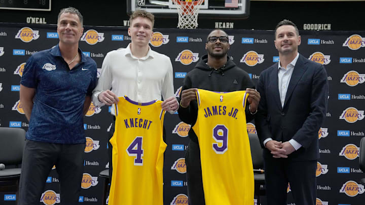Jul 2, 2024; El Segundo, CA, USA; From left: Los Angeles Lakers general manager Rob Pelinka, first round draft pick Dalton Knecht (4), second round draft pick Bronny James (9) and coach JJ Redick pose Kat a press conference at the UCLA Health Training Center. Mandatory Credit: Kirby Lee-USA TODAY Sports