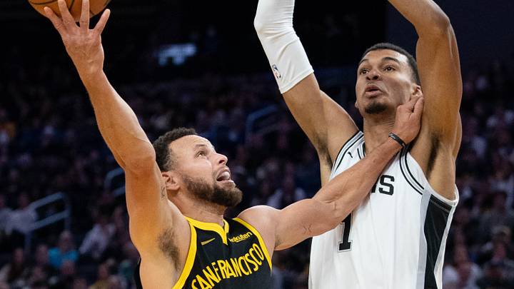 November 24, 2023; San Francisco, California, USA; Golden State Warriors guard Stephen Curry (30) shoots the basketball against San Antonio Spurs center Victor Wembanyama (1) during the third quarter at Chase Center. Mandatory Credit: Kyle Terada-Imagn Images