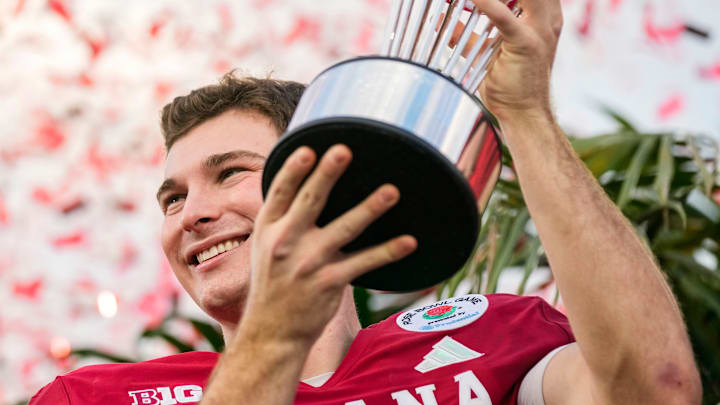 Indiana Hoosiers quarterback Fernando Mendoza (15) holds up the trophy Thursday, Jan. 1, 2026, after winning the 112th annual Rose Bowl game in Pasadena. Indiana Hoosiers defeated Alabama Crimson Tide, 38-3. Indiana Hoosiers quarterback Fernando Mendoza (15) holds up the trophy Thursday, Jan. 1, 2026, after winning the 112th annual Rose Bowl game in Pasadena. Indiana Hoosiers defeated Alabama Crimson Tide, 38-3.