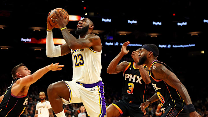 Nov 26, 2024; Phoenix, Arizona, USA: Los Angeles Lakers forward LeBron James (23) shoots the ball against Phoenix Suns guard Bradley Beal (3) during the fourth quarter at Footprint Center. Mandatory Credit: Mark J. Rebilas-Imagn Images Nov 26, 2024; Phoenix, Arizona, USA: Los Angeles Lakers forward LeBron James (23) shoots the ball against Phoenix Suns guard Bradley Beal (3) during the fourth quarter at Footprint Center. Mandatory Credit: Mark J. Rebilas-Imagn Images
