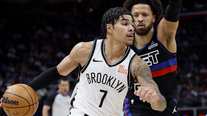 Mar 1, 2025; Detroit, Michigan, USA;  Brooklyn Nets guard Killian Hayes (7) dribbles defended by Detroit Pistons guard Cade Cunningham (2) in the first half at Little Caesars Arena. Mandatory Credit: Rick Osentoski-Imagn Images