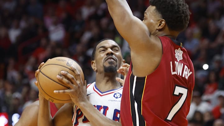 Dec 25, 2023; Miami, Florida, USA; Miami Heat guard Kyle Lowry (7) defends Philadelphia 76ers guard Dec 25, 2023; Miami, Florida, USA; Miami Heat guard Kyle Lowry (7) defends Philadelphia 76ers guard