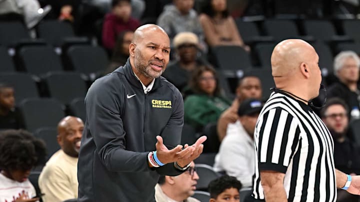 Crespi boys basketball coach Derek Fisher pleads with an official during a game against Alemany at the Intuit Dome.
