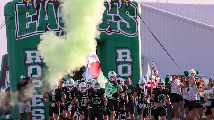 Ropes runs out to the field before a non-district football game, Friday, August 29, 2025, at Eagle Stadium in Ropesville.