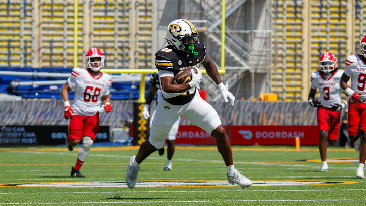 Sept. 13, 2025; Columbia, Missouri, USA; Missouri Tigers running back Jamal Roberts breaks away from Louisiana Ragin' Cajuns' defense during his 39-yard touchdown reception.