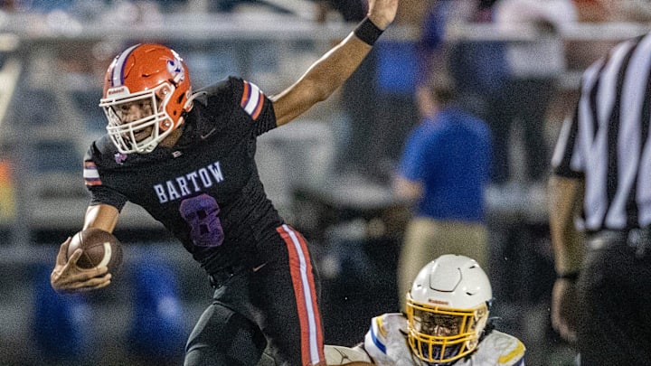 Bartow (10) quarterback Blake Johnson eludes a tackle by Auburndale defender during a run for yardage in first half action Friday September 20 2024, in Bartow Fl.
Ernst Peters/The Ledger