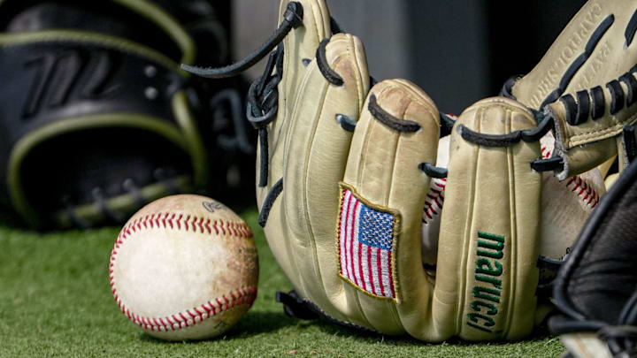 Baseball and US flag patch on a baseball glove before the top of the sixth inning at Doug Kingsmore Stadium in Clemson, S.C. Saturday, Feb 14, 2026.