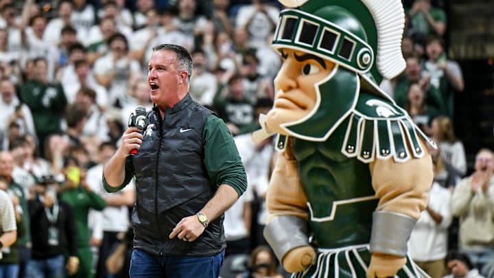 Michigan State's new football coach Pat Fitzgerald addresses the crowd during a timeout in the first half of the Spartans basketball game against Iowa on Tuesday, Dec. 2, 2025, at the Breslin Center in East Lansing. Michigan State's new football coach Pat Fitzgerald addresses the crowd during a timeout in the first half of the Spartans basketball game against Iowa on Tuesday, Dec. 2, 2025, at the Breslin Center in East Lansing.