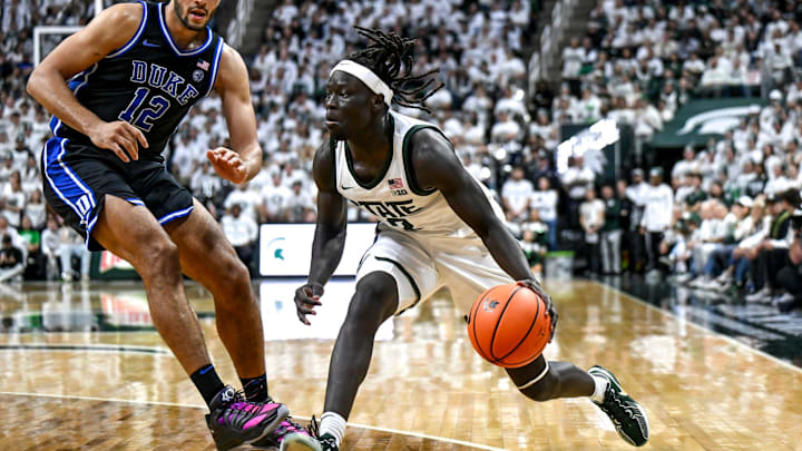 Michigan State's Kur Teng, right, moves the ball as Duke's Cameron Boozer defends during the second half on Saturday, Dec. 6, 2025, at the Breslin Center in East Lansing.