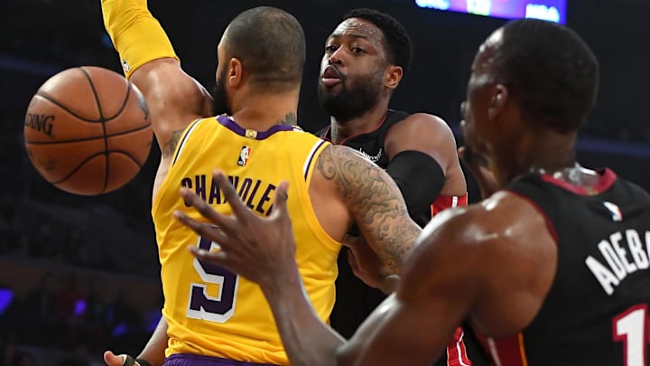 Dec 10, 2018; Los Angeles, CA, USA; Miami Heat guard Dwyane Wade (3) makes a pass around Los Angeles Lakers center Tyson Chandler (5) for a basket by Miami Heat center Bam Adebayo (13) in the first half of the game at Staples Center. Mandatory Credit: Jayne Kamin-Oncea-Imagn Images