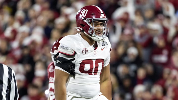 Dec 19, 2025; Norman, OK, USA; Alabama Crimson Tide defensive lineman London Simmons (90) celebrates a play  against the Oklahoma Sooners during the CFP National Playoff First Round at Gaylord Family Oklahoma Memorial Stadium. 
