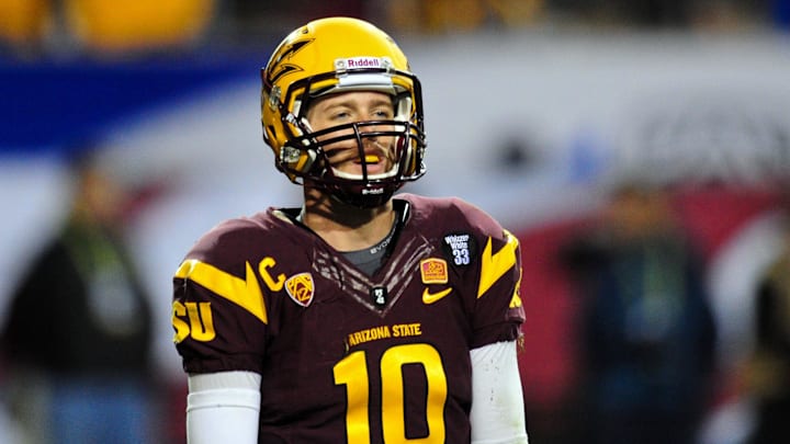 Dec 7, 2013; Tempe, AZ, USA; Arizona State Sun Devils quarterback Taylor Kelly (10) looks on during the second half against the Stanford Cardinal at Sun Devil Stadium. Mandatory Credit: Matt Kartozian-Imagn Images