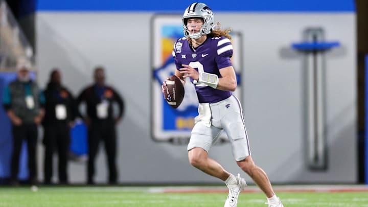 Dec 28, 2023; Orlando, FL, USA;  Kansas State Wildcats quarterback Avery Johnson (2) drops back to pass the ball down the field.