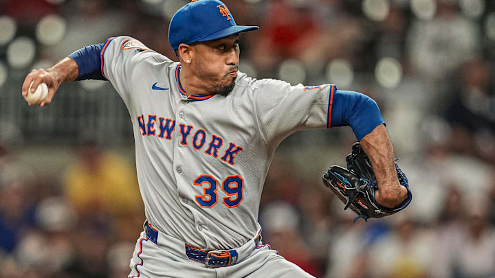 Aug 23, 2025; Cumberland, Georgia, USA; New York Mets relief pitcher Edwin Diaz (39) pitches against the Atlanta Braves during the ninth inning at Truist Park. Mandatory Credit: Dale Zanine-Imagn Images
