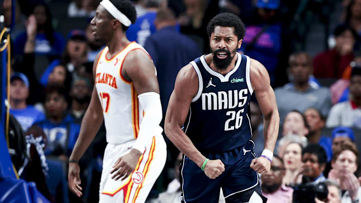 Apr 2, 2025; Dallas, Texas, USA;  Dallas Mavericks guard Spencer Dinwiddie (26) reacts in fron tof Atlanta Hawks forward Onyeka Okongwu (17) after scoring during the fourth quarter at American Airlines Center. Mandatory Credit: Kevin Jairaj-Imagn Images