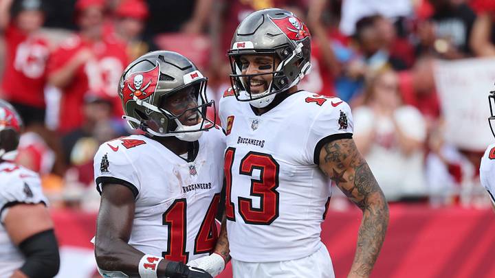 Sep 8, 2024; Tampa, Florida, USA; Tampa Bay Buccaneers wide receiver Mike Evans (13) celebrates with wide receiver Chris Godwin (14) after he scored a touchdown against the Washington Commanders during the first half at Raymond James Stadium. Mandatory Credit: Kim Klement Neitzel-Imagn Images Sep 8, 2024; Tampa, Florida, USA; Tampa Bay Buccaneers wide receiver Mike Evans (13) celebrates with wide receiver Chris Godwin (14) after he scored a touchdown against the Washington Commanders during the first half at Raymond James Stadium. Mandatory Credit: Kim Klement Neitzel-Imagn Images