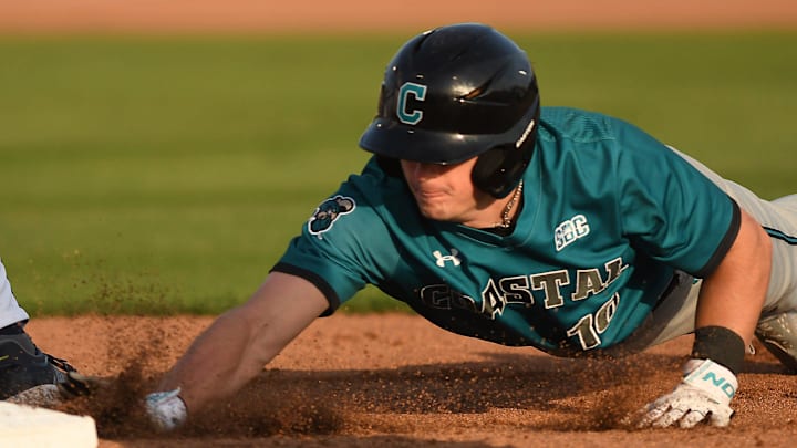 Coastal's #10 Sam Antonacci jumps back to 1st base as UNCW took on Coastal Carolina Tuesday April 2, 2024 at home. UNCW won 6-4. KEN BLEVINS/STARNEWS