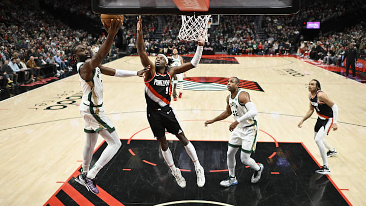 Mar 11, 2024; Portland, Oregon, USA; Boston Celtics guard Jaylen Brown (7) scores a basket during the first half against Portland Trail Blazers forward Jerami Grant (9) at Moda Center. Mandatory Credit: Troy Wayrynen-Imagn Images Mar 11, 2024; Portland, Oregon, USA; Boston Celtics guard Jaylen Brown (7) scores a basket during the first half against Portland Trail Blazers forward Jerami Grant (9) at Moda Center. Mandatory Credit: Troy Wayrynen-Imagn Images