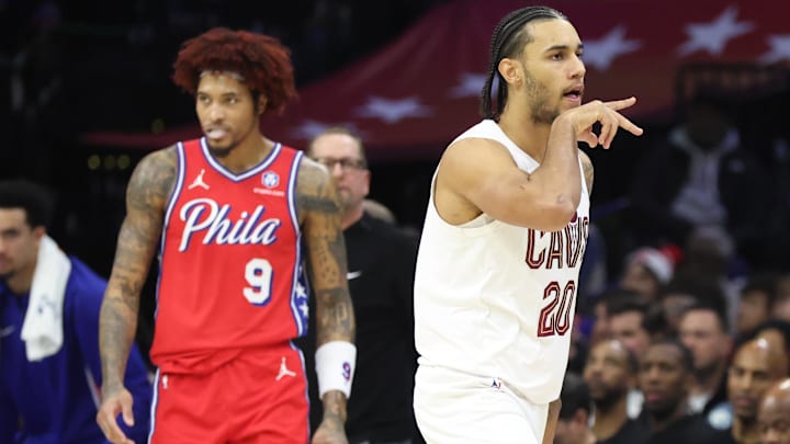 Jan 16, 2026; Philadelphia, Pennsylvania, USA; Cleveland Cavaliers guard Jaylon Tyson (20) reacts in front of Philadelphia 76ers guard Kelly Oubre Jr. (9) after his three pointer during the second quarter at Xfinity Mobile Arena. Mandatory Credit: Bill Streicher-Imagn Images