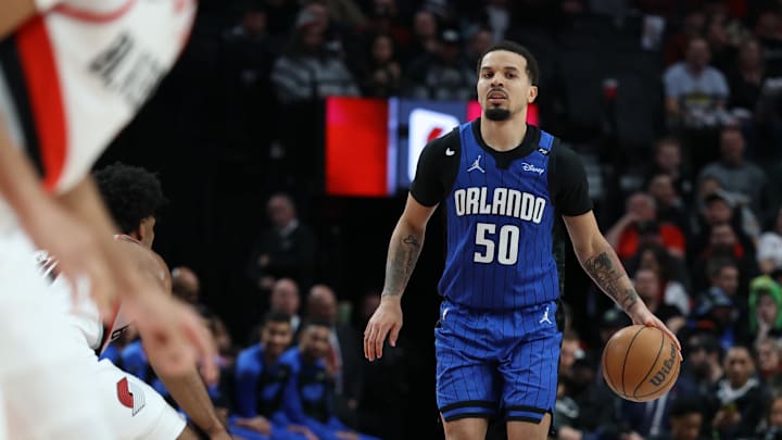 Orlando Magic guard Cole Anthony (50) brings the ball up the court against the Portland Trail Blazers in the second half at Moda Center.
