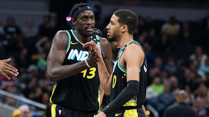 Mar 16, 2024; Indianapolis, Indiana, USA;  Indiana Pacers forward Pascal Siakam (43) celebrates with guard Tyrese Haliburton (0) in the first half against the Brooklyn Nets at Gainbridge Fieldhouse. Mandatory Credit: Trevor Ruszkowski-Imagn Images