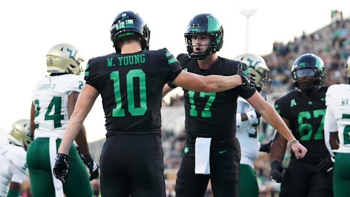 Oct 10, 2025; Denton, Texas, USA; North Texas Mean Green quarterback Drew Mestemaker (17) celebrates a touchdown with wide receiver Wyatt Young (10) against the South Florida Bulls during the first half of a game at DATCU Stadium. Mandatory Credit: Raymond Carlin III-Imagn Images