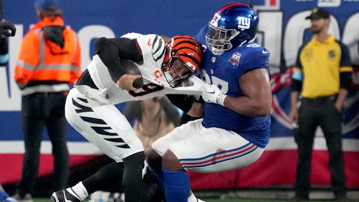 Bengals quarterback Joe Burrow is sacked by Giants defensive tackle Dexter Lawrence.