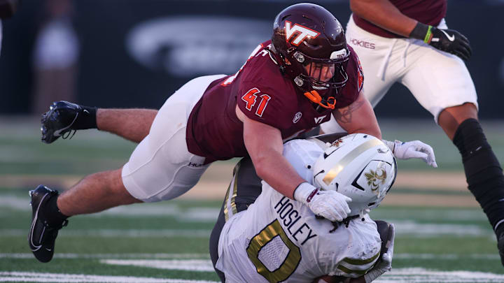 Oct. 11, 2025; Atlanta, Ga.; Virginia Tech linebacker George Ballance (41) tackles Georgia Tech running back Malachi Hosley (0).
