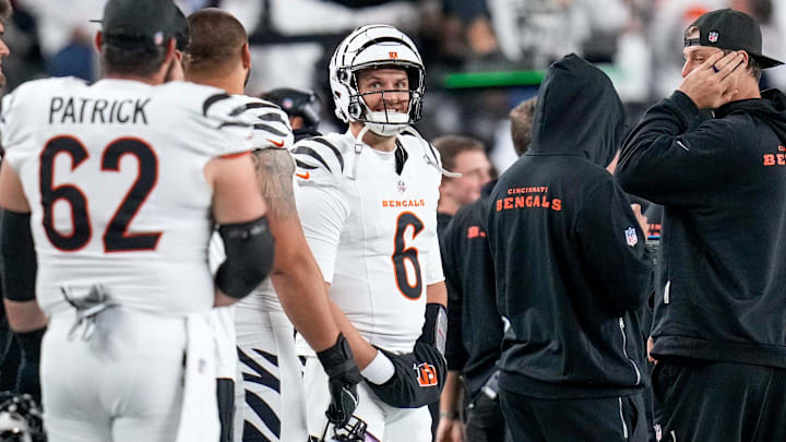 Former Husky QB Jake Browning (6) smiles while watching the Bengals pull out a 2025 victory. 